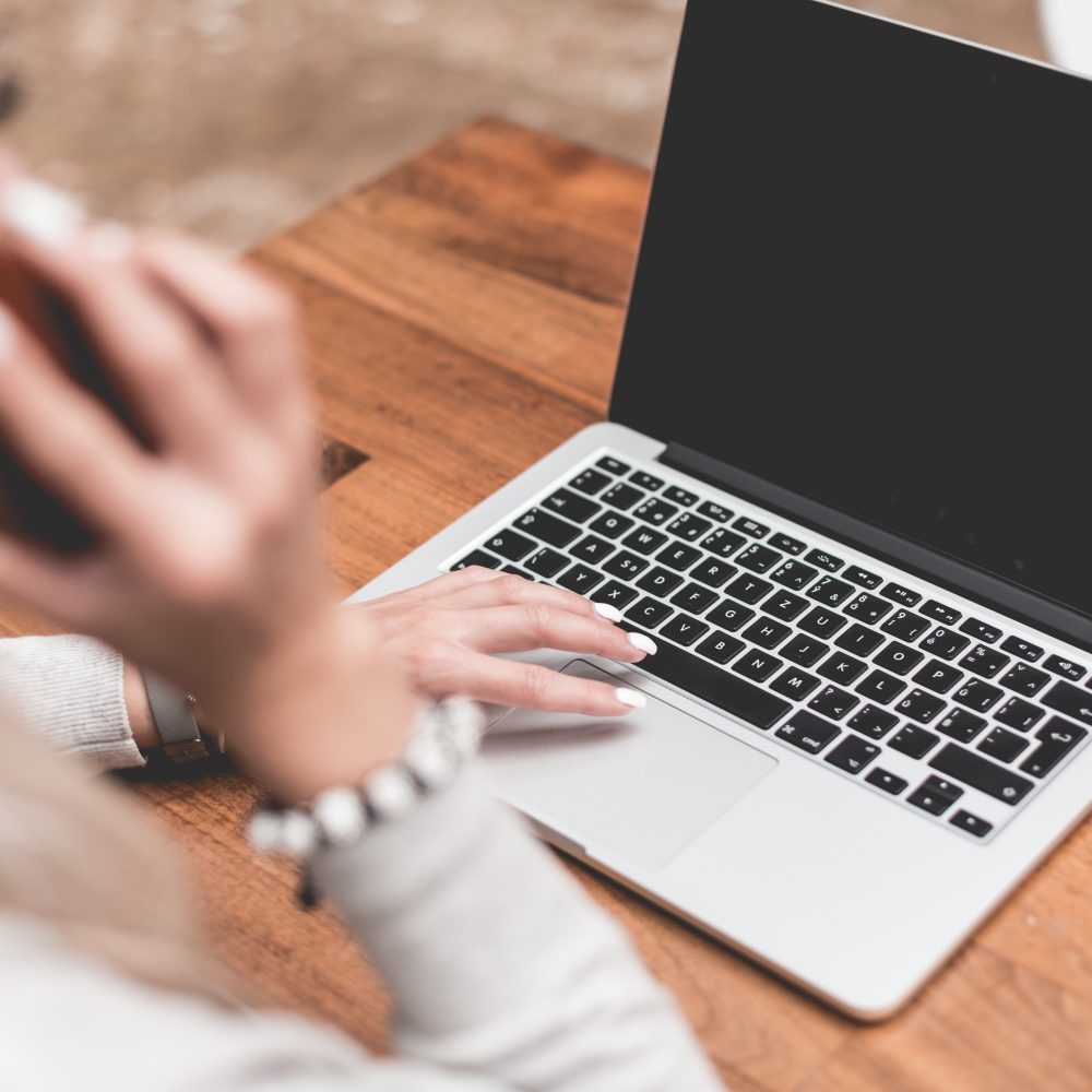 woman-calling-while-working-remotely-on-laptop-picjumbo-com